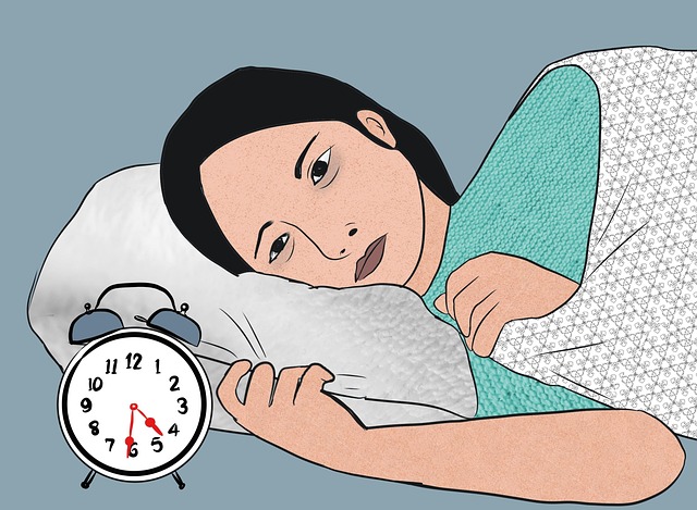 夜中に目が覚めて困っている人のイラスト